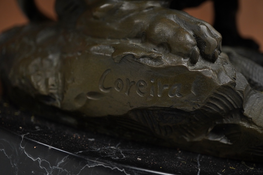 A patinated bronze group of a lion and snake, J.B Paris foundry stamp, signed Coreira, on a black marble base, 23cm high